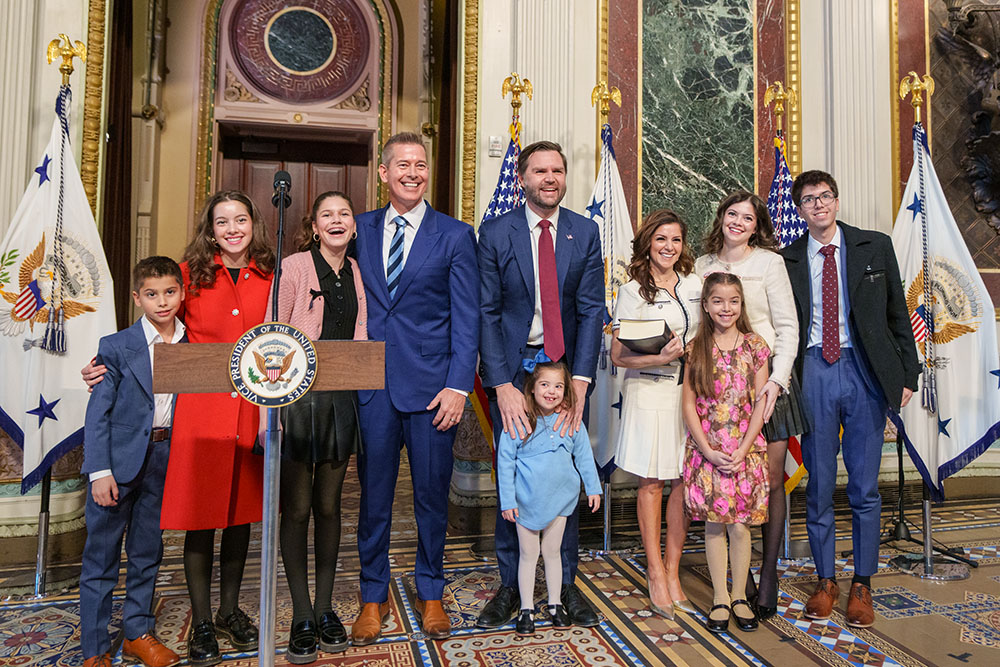 Newly sworn-in Transportation Secretary Sean Duffy, center left, and his wife, Rachel Campos-Duffy, center right, pose for a photo with their children and Vice President JD Vance, center, at the Eisenhower Executive Office Building in Washington, Jan. 28, 2025. (Wikimedia Commons/U.S. Department of Transportation)