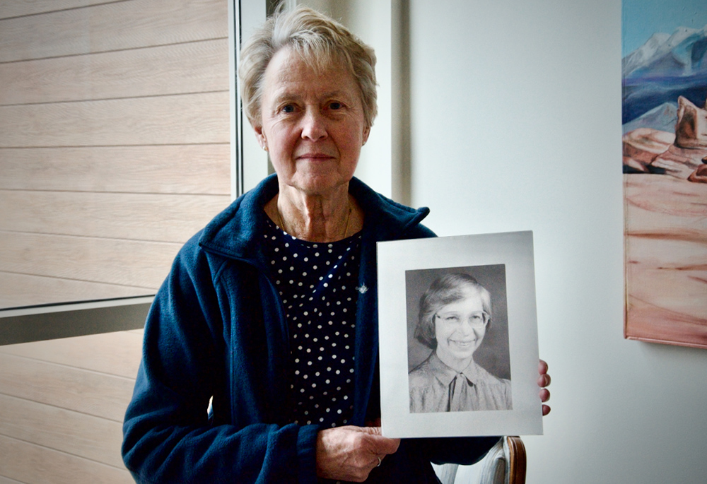 Cleveland Ursuline Sr. Gretchen Rodenfels holds a portrait of Sr. Joanne Marie Mascha, who was raped and murdered in 1995. Rodenfels taught at the same school as Mascha, and later lived with her at the motherhouse. (GSR photo/Dan Stockman)