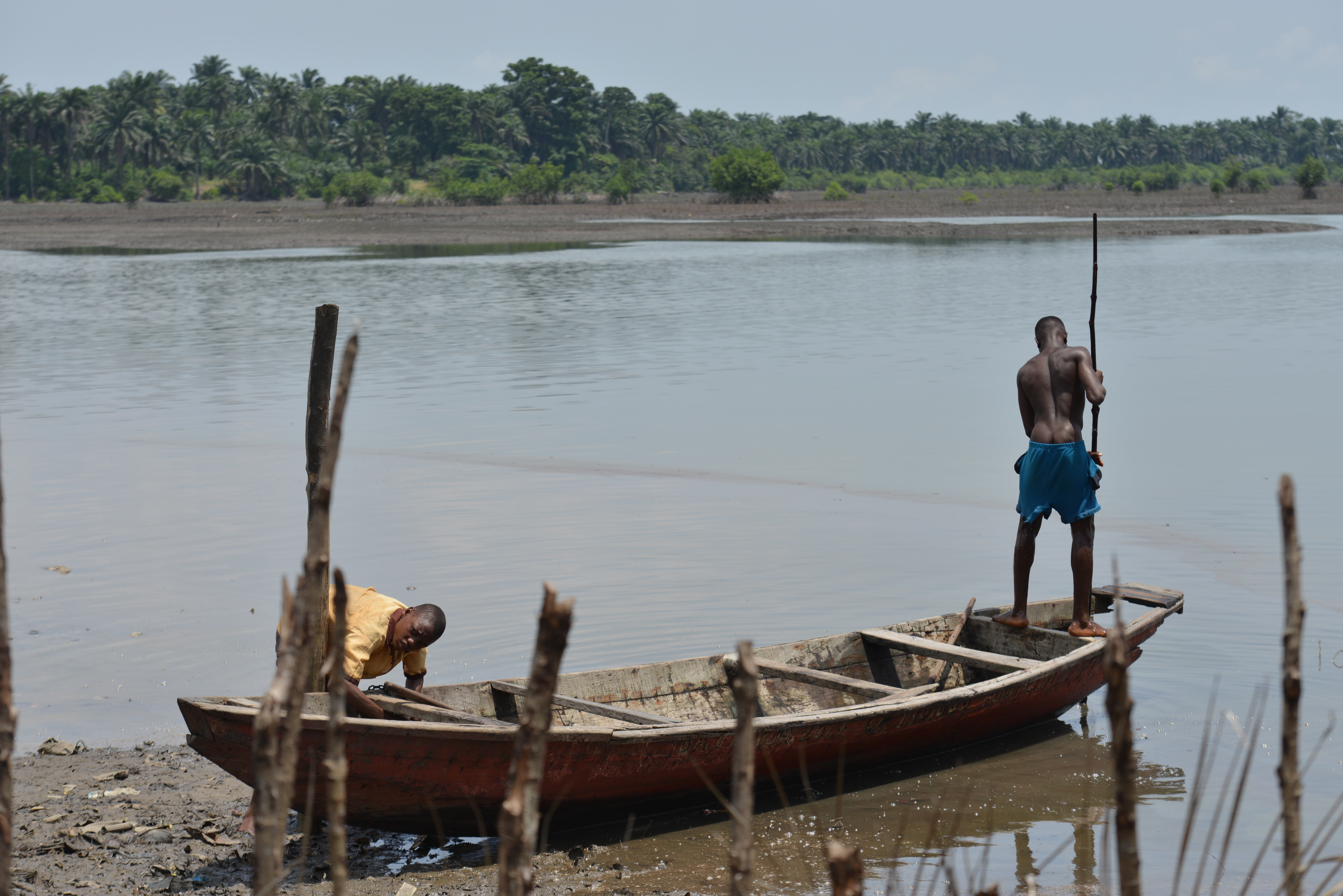 Two fishermen in Bodo, Nigeria arrive home with no catch after oil spills have affected aquatic life in local communities.