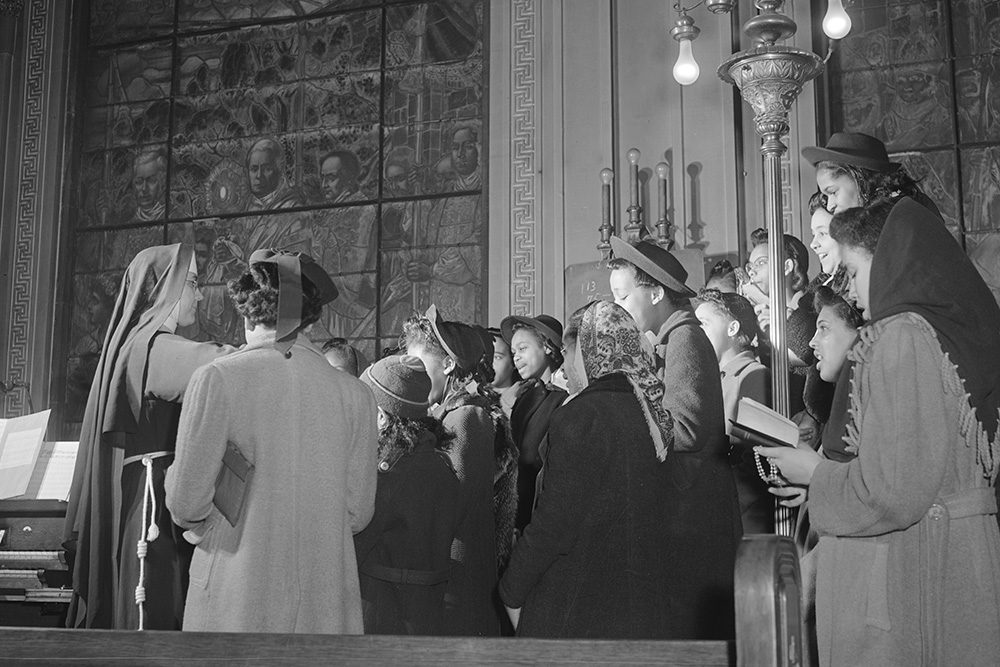 Young people sing in the choir loft of Corpus Christi Church, a predominantly black Catholic parish, in Chicago in 1942. (Library of Congress/Jack Delano)