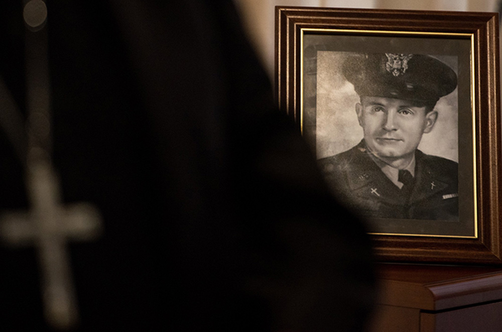 A photo of Fr. Emil Kapuan, a Wichita, Kansas, priest and a U.S. Army chaplain who died in the line of duty during the Korean War, is displayed on a table Sept. 21, 2021, during a chain of custody ceremony at the at the Defense POW/MIA Accounting Agency facility on Joint Base Pearl Harbor-Hickam, Hawaii. (CNS/U.S. Air Force via DVIDS/Tech. Sgt. Rusty Frank)