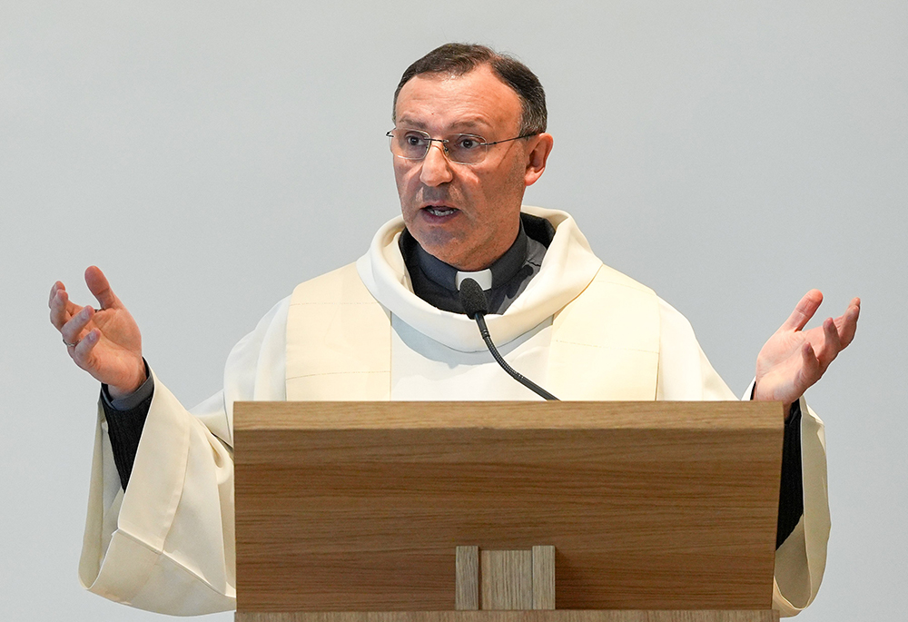 Fr. Nunzio Currao, chaplain of Rome's Gemelli Hospital, leads a prayer service and eucharistic adoration in the hospital chapel on Feb. 27. (CNS/Lola Gomez)