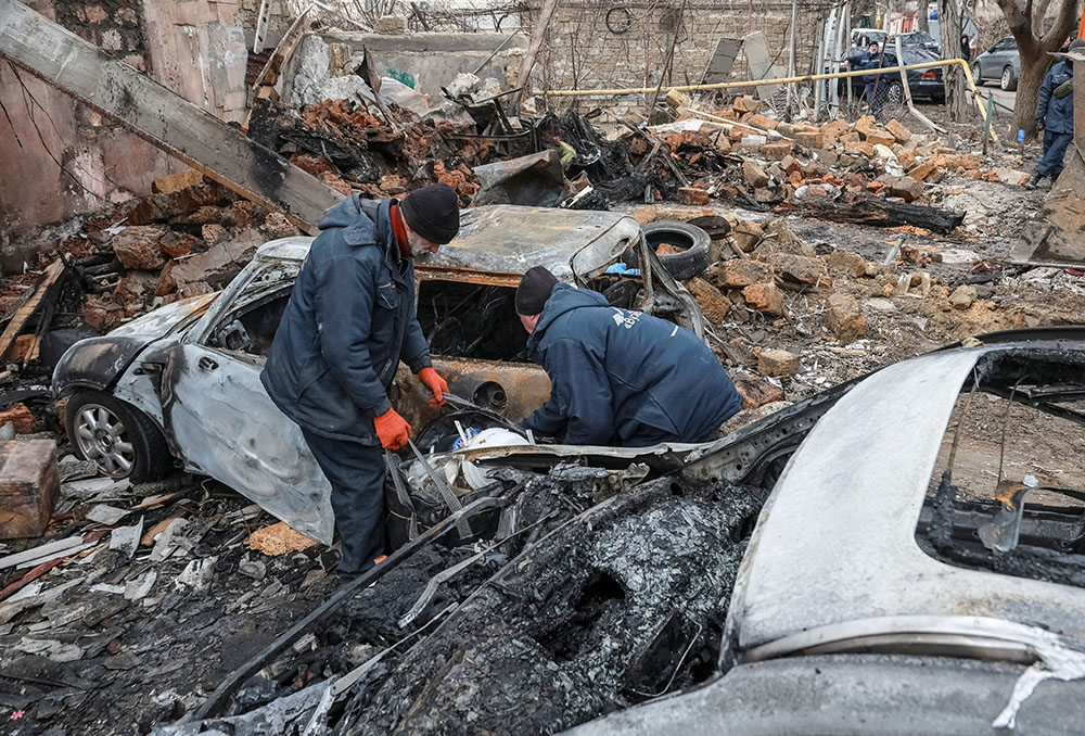 Residents are seen at a site of an apartment building in Odesa, Ukraine, March 4, 2025, hit by a Russian drone strike, amid Russia's attack on Ukraine. (OSV News/Reuters/Nina Liashonok)