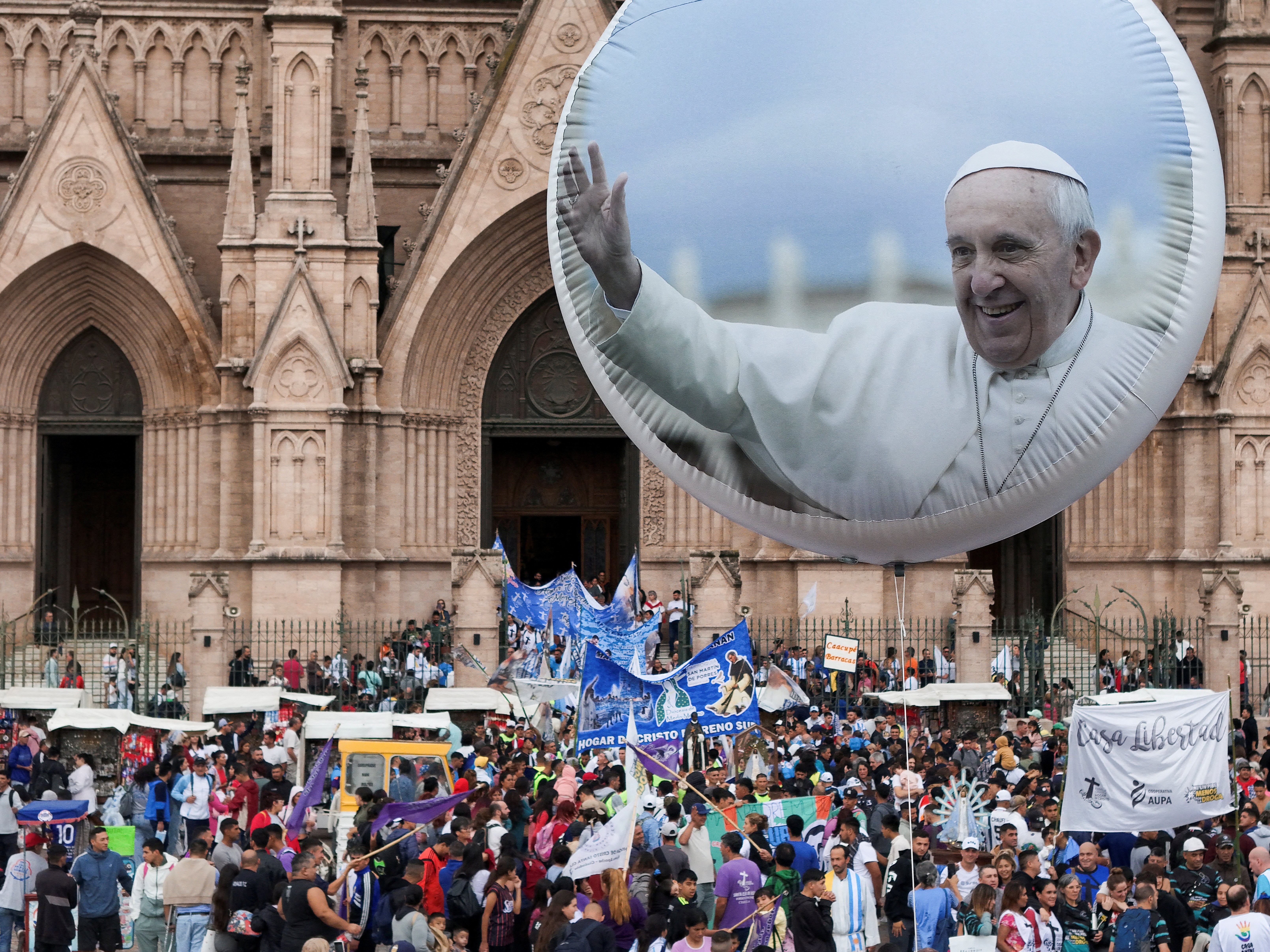  ARGENTINA MASS POPE FRANCIS RECOVERY A balloon with an image of Pope Francis is seen as thousands of worshippers gather to attend a Mass at the Basilica of Lujan in Buenos Aires, Argentina, March 16, 2025, to pray for the pope amid his ongoing treatment for double pneumonia at Rome's Gemelli Hospital, where he was admitted Feb. 14. The Vatican confirmed that the 88-year-old pontiff concelebrated Mass at the hospital chapel March 16. (OSV News photo/Martin Cossarini, Reuters)