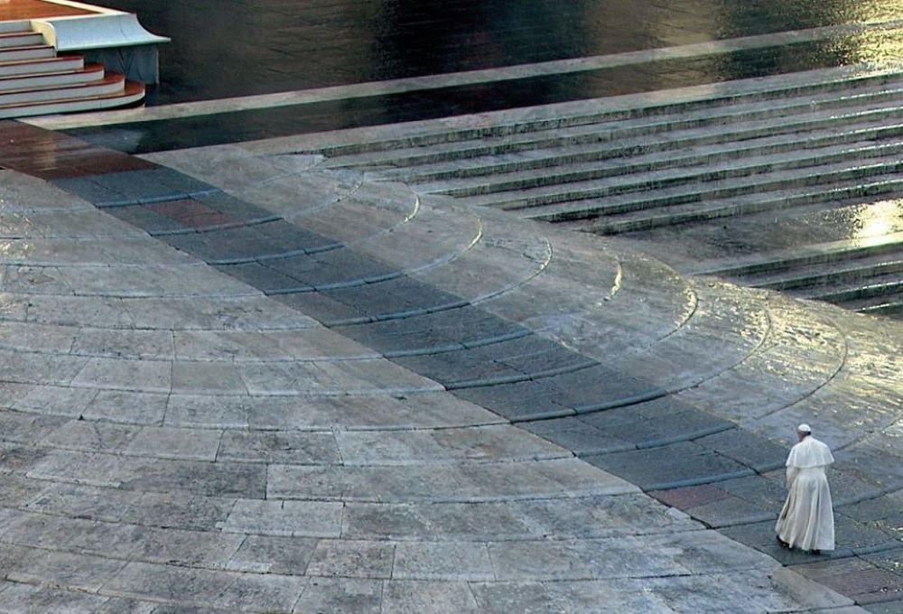 Pope prays alone in empty St. Peter's Square.