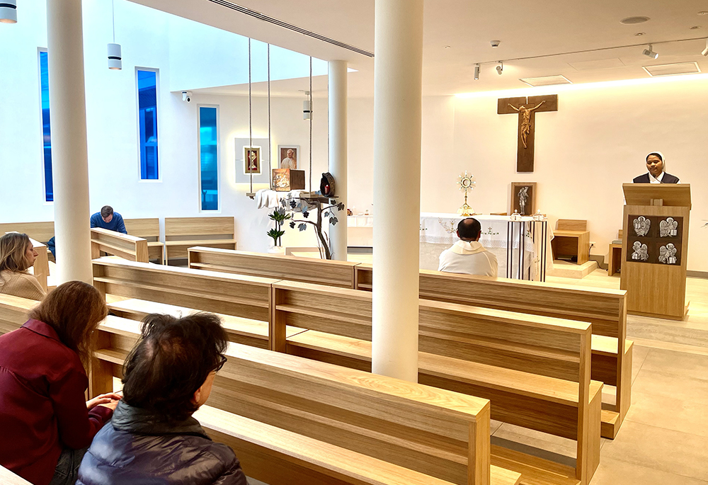 Faithful and Gemelli personnel pray in the St. John Paul II Chapel at Gemelli Hospital during a eucharistic adoration service led by Fr. Nunzio Currao, on March 7. (NCR photo/Camillo Barone)