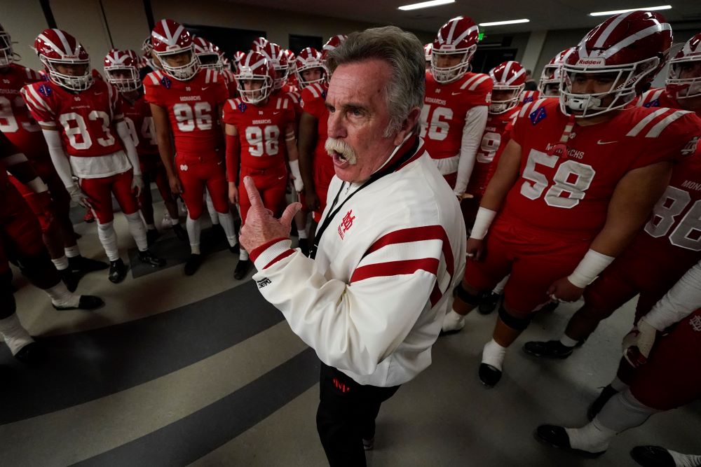 Mater Dei head coach Bruce Rollinson talks to his team before the 2021 CIF Open Division high school football state championship game Dec. 11, 2021, in Mission Viejo, Calif. The team won the state championship game 44-7. (AP/Ashley Landis)