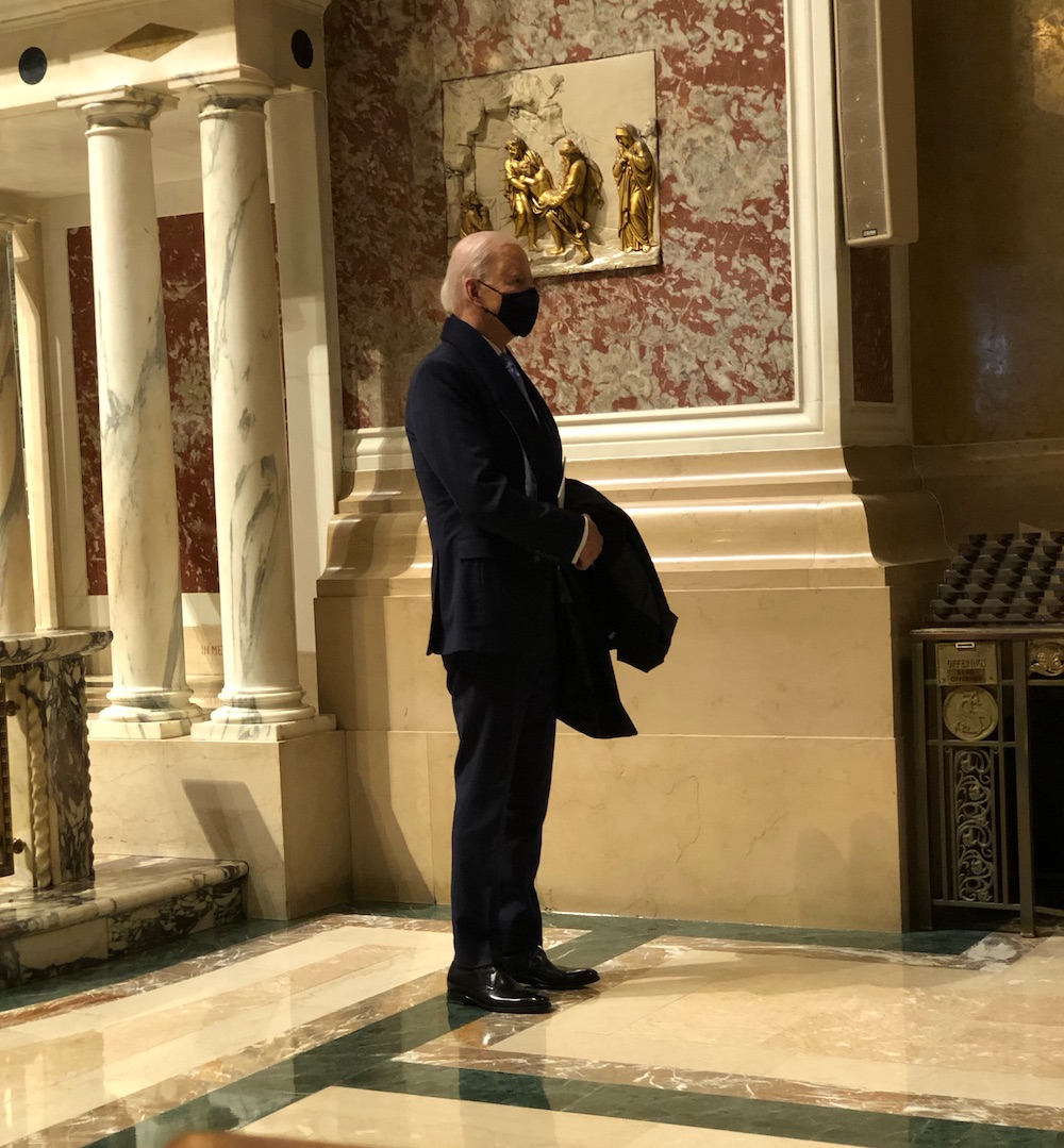 Then President-elect Joe Biden listens to the last verse of "America the Beautiful" before greeting Renée Fleming at the end of Mass Jan. 20, 2021, at Cathedral of St. Matthew the Apostle in Washington, D.C. (Thomas Stehle)