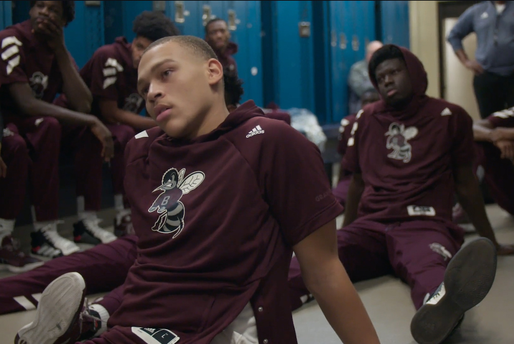 St. Benedict's basketball players C.J. Wilcher, left, and Madani Diarra sit in the locker room pictured in "Benedict Men" (Quibi/Whistle Studios)