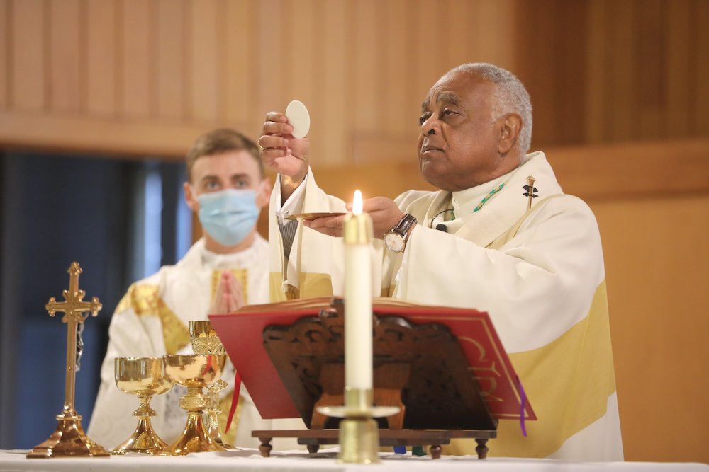 Then Cardinal-designate Wilton Gregory, the archbishop of Washington, celebrates Mass Oct. 25, 2020, at Holy Angels Church in Avenue, Maryland. (CNS/Catholic Standard/Andrew Biraj)