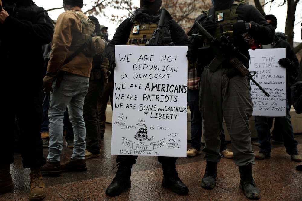 Militia groups in Columbus, Ohio, gather outside the state capitol to protect President Donald Trump supporters Jan. 17, 2021, as they protest presidential election results. (CNS/Reuters/Megan Jelinger)