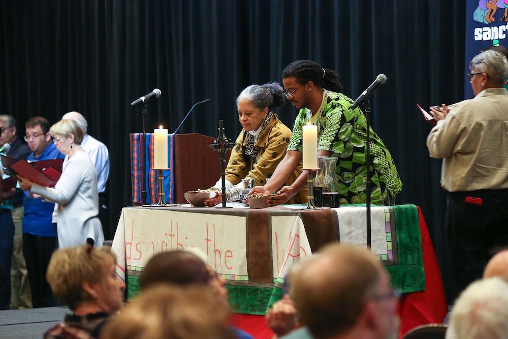 Derek Rankins, left, and Debra Brittenum participate in liturgy at the 2018 Call to Action national conference in San Antonio, Texas. (Call to Action)