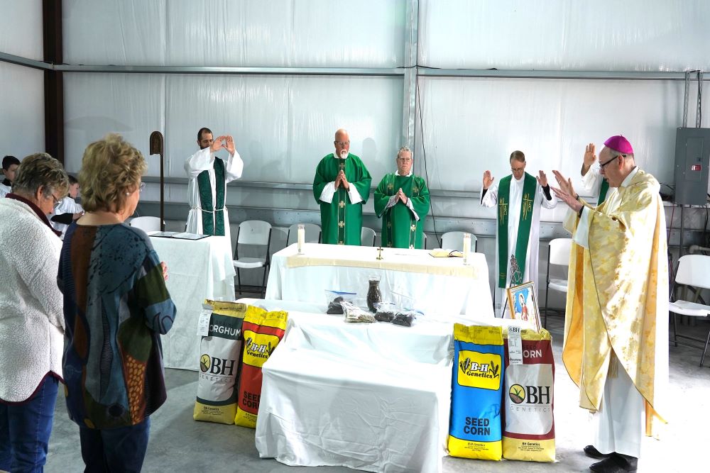 Bishop Brendan J. Cahill of Victoria, Texas, blesses samples of seed and soil in Ganado, Texas, Jan. 15. (CNS/The Catholic Lighthouse/Janet Jones)