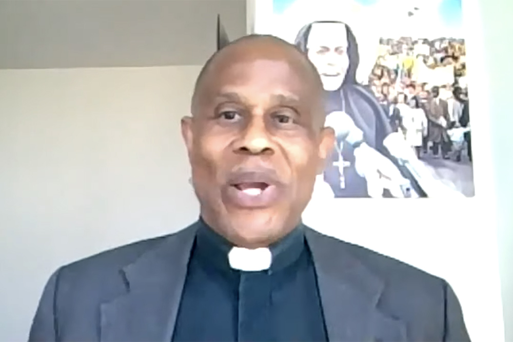 Fr. Bryan Massingale accepts Pax Christi USA's "Teacher of Peace" award July 31 during the organization's national conference, held via Zoom. (NCR screenshot)