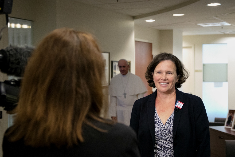 Jeanne Atkinson speaks to a TV news reporter at CLINIC's offices in Washington, D.C. (Provided photo)