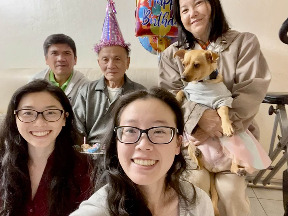 Writer Theresa La, center, with family members, from left: sister Lucia, her uncle, grandfather, mother and dog Bailey (Courtesy of Theresa La)