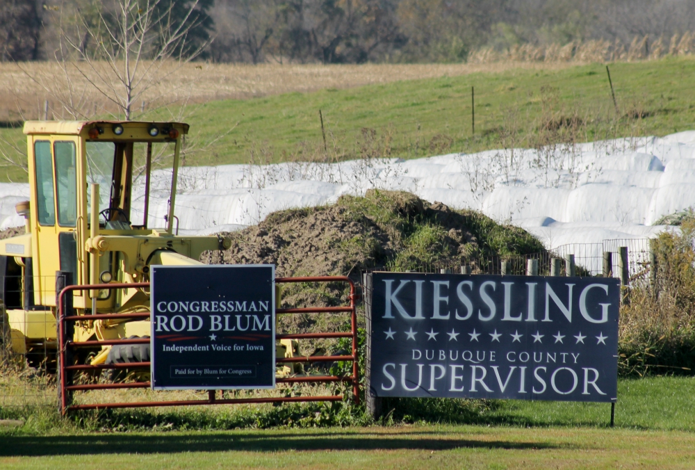 A sign supporting Republican Rep. Rod Blum's re-election to the U.S. House of Representatives is posted on a fence at a farm outside Dyersville, Iowa. (NCR photo/Brian Roewe)