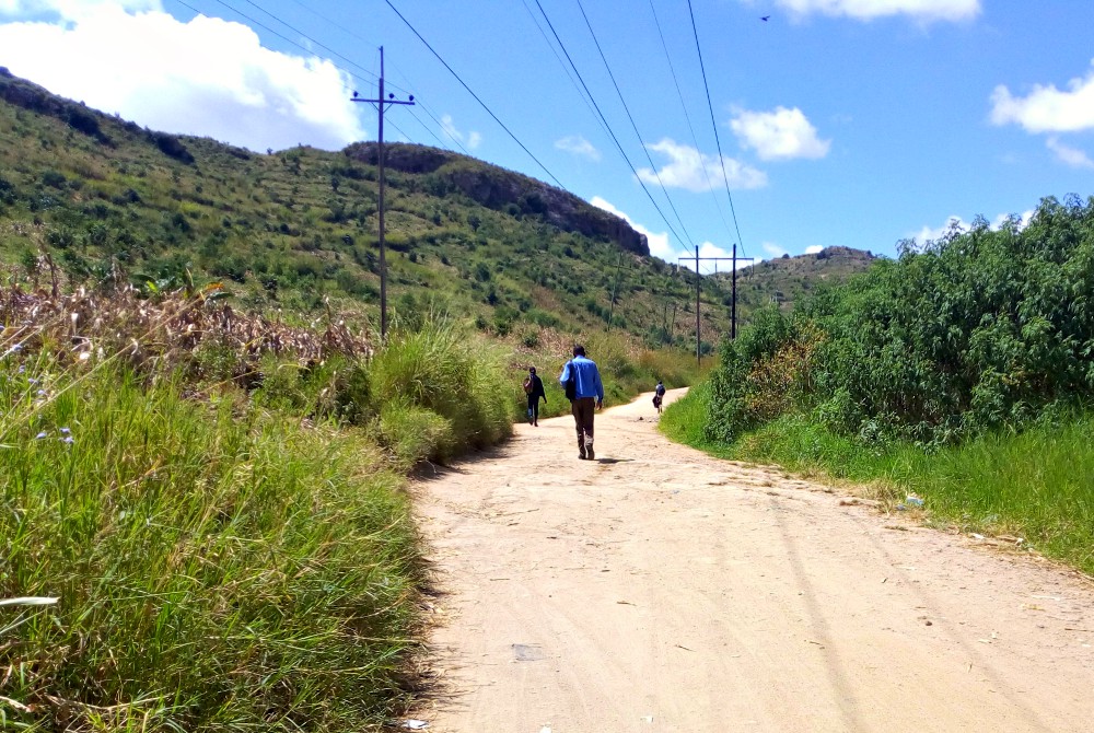 People walk along a road in Malawi April 13. (Wikimedia Commons/Matt Khofi)