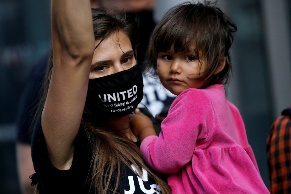 Restaurant workers in New York City protest Sept. 30, demanding to be paid full minimum wage with tips as they risk exposure to the coronavirus disease with local restaurants beginning indoor dining. (CNS/Reuters/Andrew Kelly)