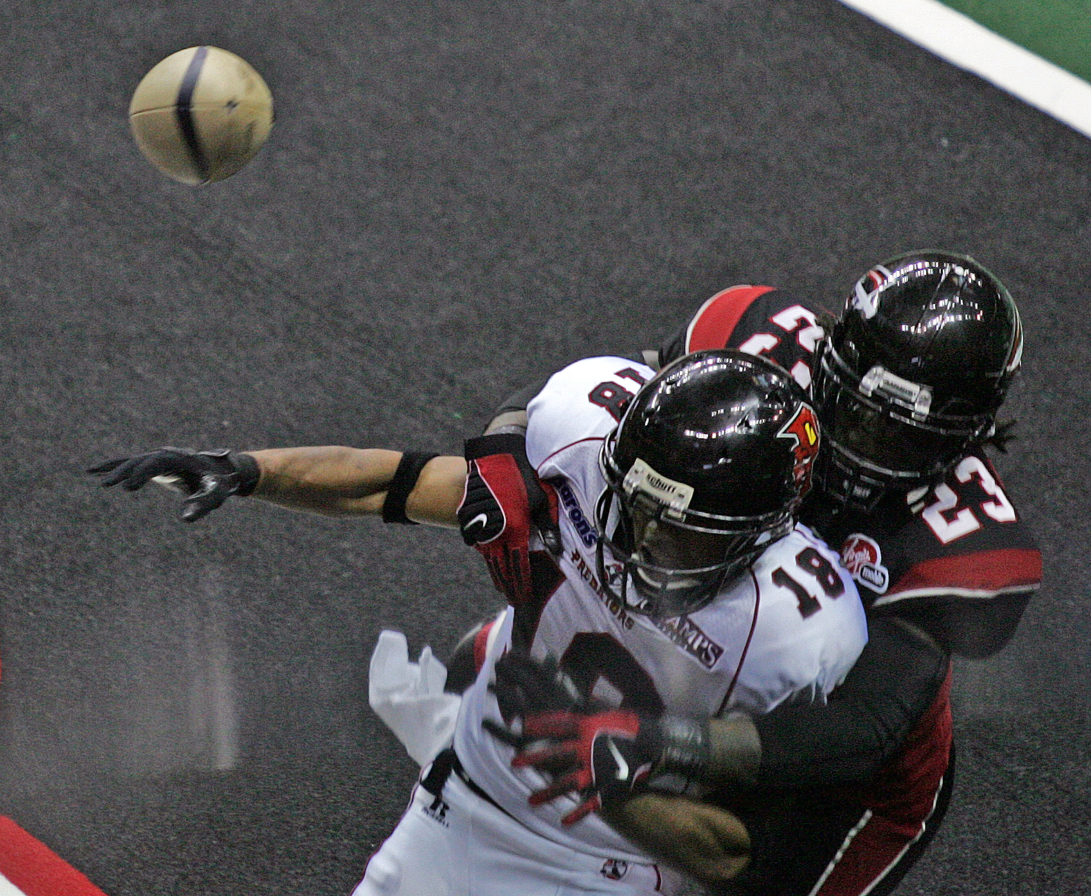 Alphonso Hodge (23) of the Gladiators breaks up a pass to Orlando player Kevin Nickerson (18) during a game at the Arena Football Playoffs at Quicken Loans Arena June 30, 2008 in Cleveland. Nickerson has served as Los Angeles Rams chaplain since 2016. 