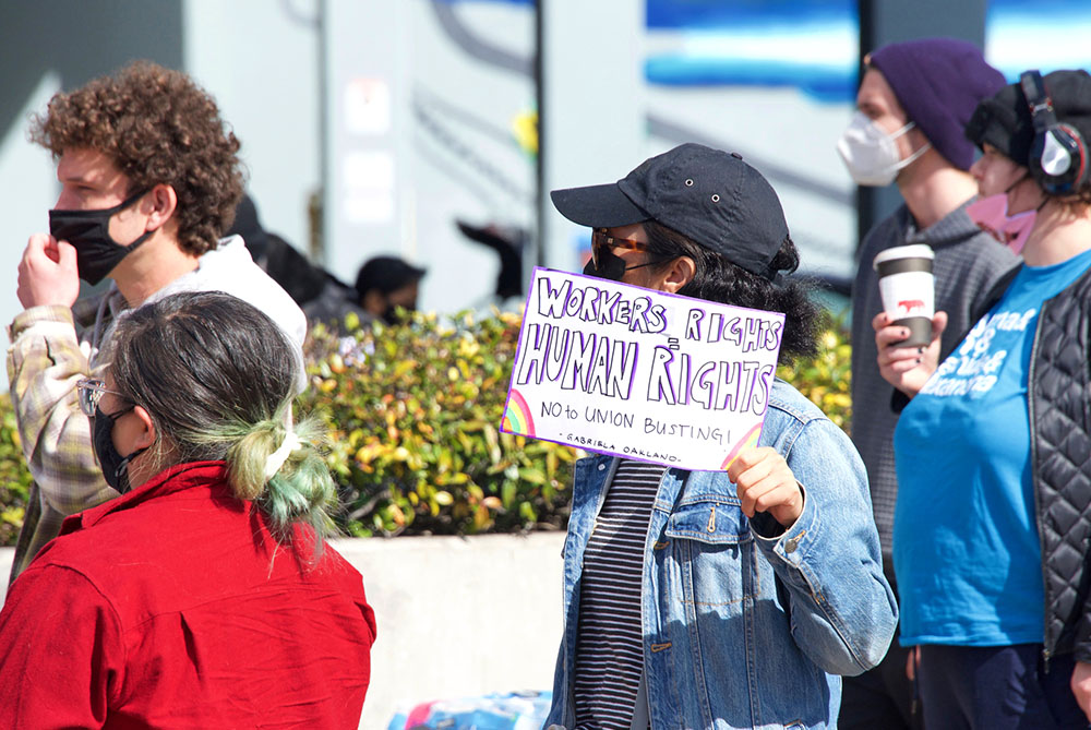 In Oakland, California, on Feb. 20, people protest Amazon's treatment of employees and its attempts to thwart formation of a union for workers. (Dreamstime/Sheila Fitzgerald)