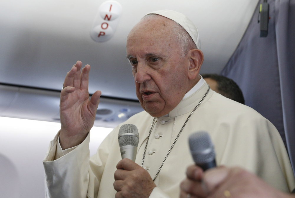 Pope Francis answers questions from journalists aboard his flight from Sibiu, Romania, to Rome June 2. (CNS/Paul Haring)