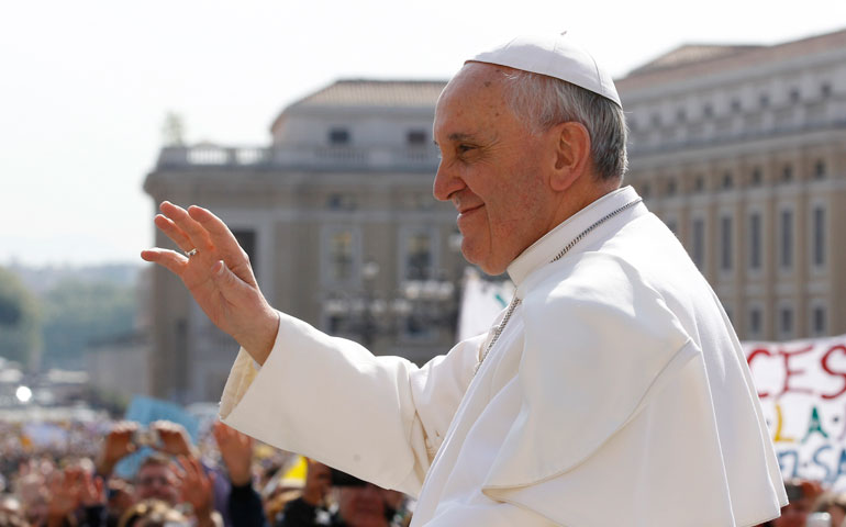 Pope Francis waves as he arrives to lead his general audience in St. Peter’s Square at the Vatican April 24. (CNS/Paul Haring)