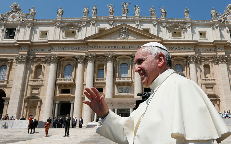 Pope Francis greets the crowd as he leaves his general audience in St. Peter's Square at the Vatican June 11. (CNS/Paul Haring)