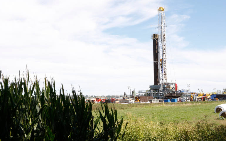 A natural gas well near a cornfield in Pulaski Township in Lawrence County, Pa. Thousands of wells have appeared across Pennsylvania since 2006, as energy companies seek to capitalize on rich deposits of natural gas in deep shale formations despite concerns of contamination and illness raised by landowners and activists. (CNS photo/Dennis Sadowski)