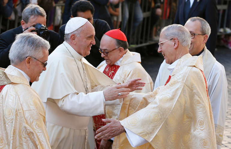 Pope Francis greets Fr. Adolfo Nicolas, superior general of the Society of Jesus, as he arrives to celebrate a Mass at the Church of St. Ignatius in Rome April 24. (CNS/Paul Haring)