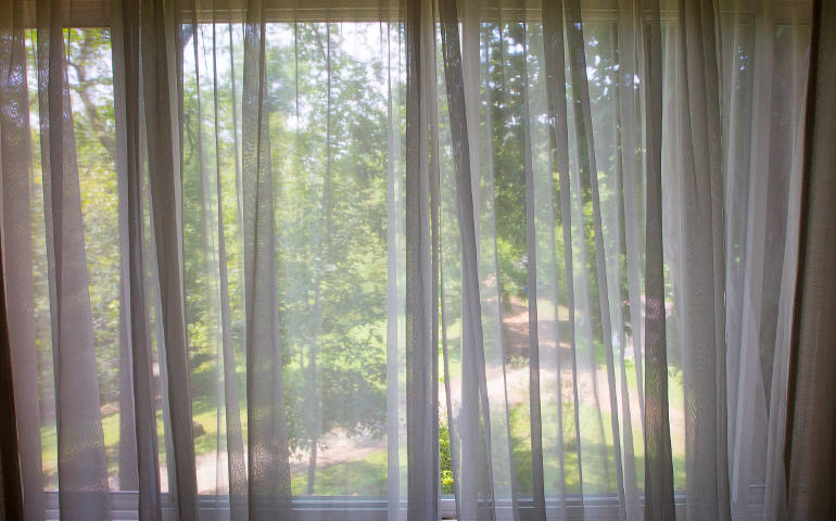 A view from the home of St. Joseph Sr. Gretchen Shaffer of the Big Laurel Learning Center in Kermit, W. Va. Shaffer, who has ministered to the center's neighbors since 1976, said mountaintop removal has harmed tree-covered mountains, turning them into acres grass. (CNS photo/Tyler Orsburn)