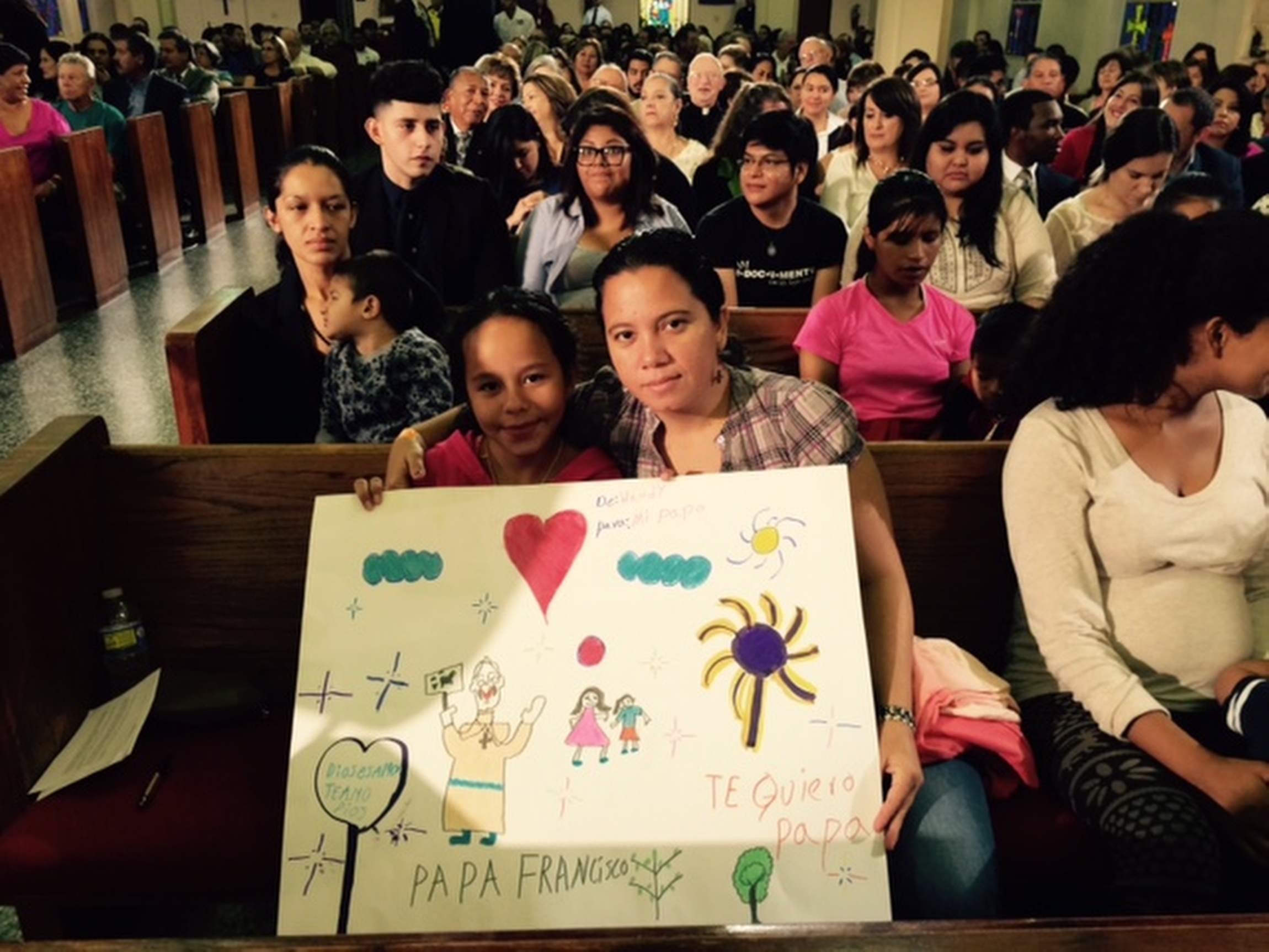 Members of Sacred Heart Church in McAllen, Texas, participate in a virtual town hall meeting with Pope Francis connected via satellite link from the Vatican Aug. 31. The meeting also included Catholics from Chicago and Los Angeles and was arranged and hosted by ABC News. (CNS/courtesy of ABC News) 