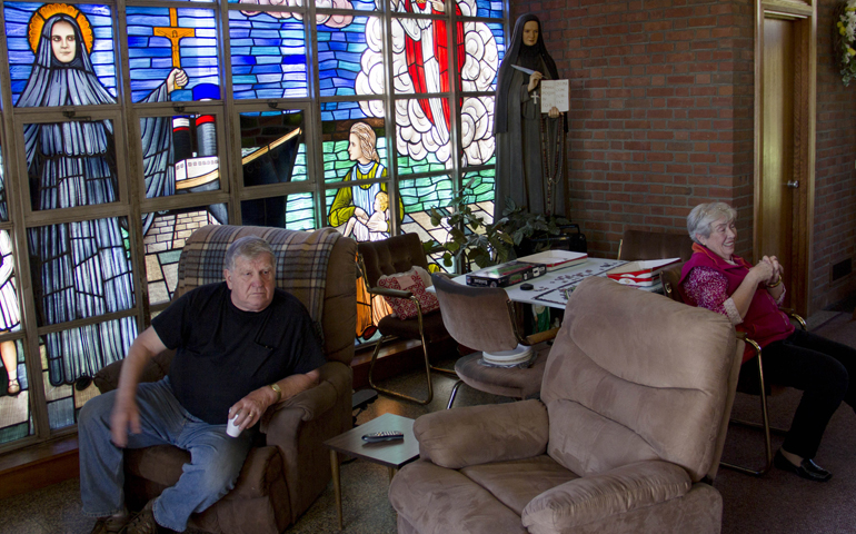 Former parishioners at the now-closed St. Frances Cabrini Church in Scituate, Mass., are seen holding a vigil in mid-May 2015. (CNS/Christopher S. Pineo, Pilot photo)