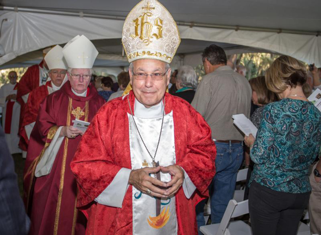 Bishop Felipe Estevez of St. Augustine, Fla., arrives in procession to celebrate Mass near Tallahassee Oct. 12. (CNS photo/Woody Huband, St. Augustine Catholic) 