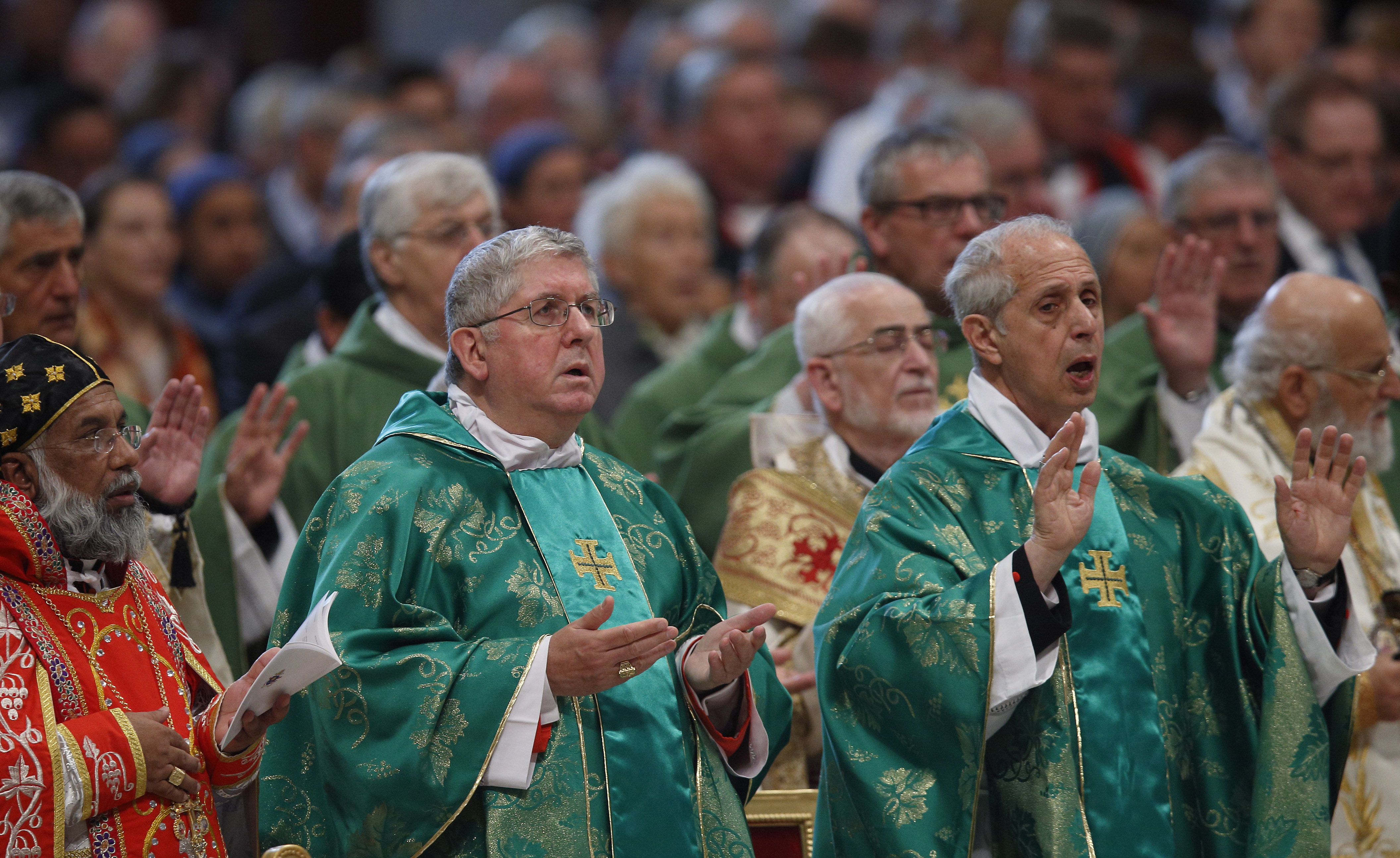 Cardinals Baselios Cleemis Thottunkal of Trivandrum, India, major archbishop of the Syro-Malankara Catholic Church, Thomas Collins of Toronto and Mario Poli of Buenos Aires, Argentina, attend the closing Mass of the Synod of Bishops on the family celebrated by Pope Francis in St. Peter's Basilica at the Vatican Oct. 25. (CNS/Paul Haring)