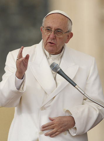 Pope Francis delivers his blessing during his general audience in St. Peter's Square at the Vatican Dec. 16. (CNS/Paul Haring) 