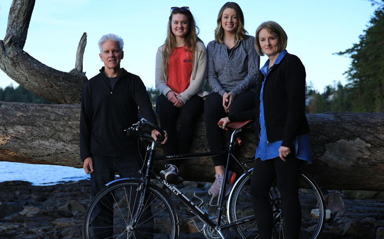 Denver bicyclist Skip Rodgers and his family pose in the state of Washington at the start of his Ride for Hope and Mercy, which began June 13. (CNS/Steve Seguin, One Billion Stories)