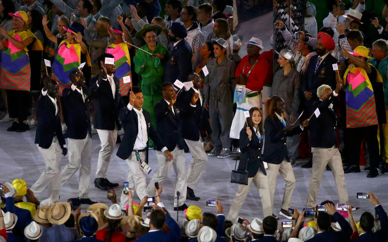 The new Refugee Olympic Team arrives for the opening ceremony in Rio de Janeiro Aug. 5. In a personal message addressed to each of the 10 members, Pope Francis wished them success in their events and thanked them for the witness to the world. (CNS photo/David Gray, Reuters)