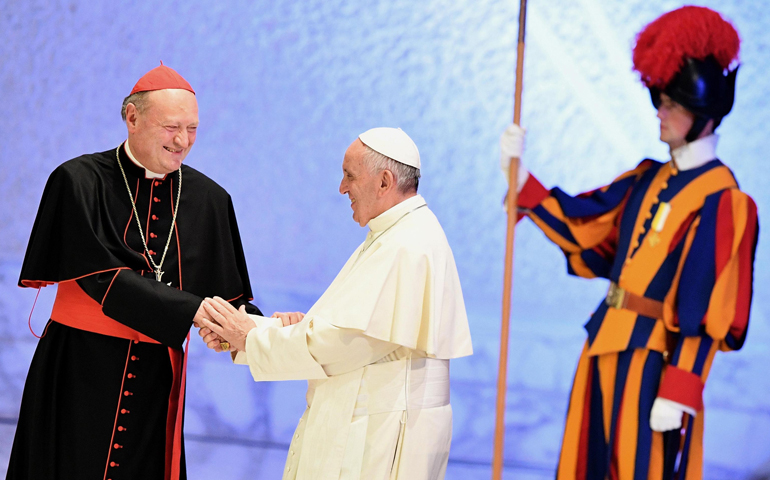 Cardinal Gianfranco Ravasi greets Pope Francis at a world conference on faith and sport Oct. 5, 2016, in the Vatican's Paul VI audience hall. (CNS photo/Ettore Ferrari, EPA)