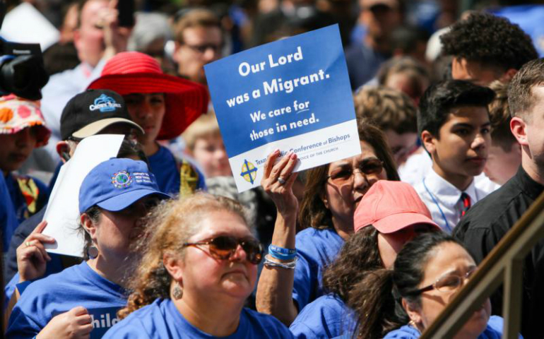 A woman holds up a sign supporting the needs of migrants during Texas Advocacy Day at the Texas Capitol in Austin April 4. (CNS photo/James Ramos, Texas Catholic Herald)