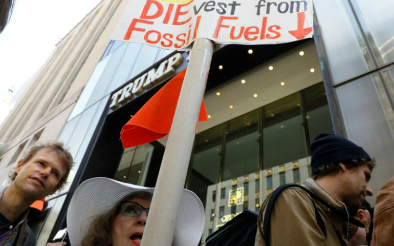 Protesters gather for a fossil fuel and climate change protest outside Trump Tower May 9 in New York City. (CNS/Brendan McDermid, Reuters)