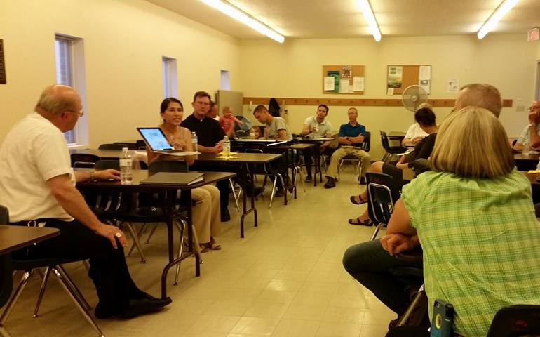 Cecilia Calvo, second from left, speaks at St. Ann Cathedral in Great Falls, Mont., Aug. 25 as part of a serious of dialogue sessions on Pope Francis' encyclical, "Laudato Si', on Care for Our Common Home." At each event, Bishop Michael Warfel, left, joined Calvo, who heads the U.S. bishops’ Environmental Justice Program and has presented roughly a dozen times on the encyclical since its June 18 release. (Darren Eultgen/Diocese of Great Falls-Billings, Mont.) 