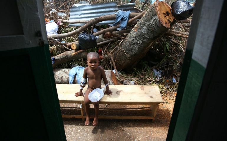 A child sick with cholera receives medical assistance at Saint Antoine Hospital in Jeremie, Haiti, Oct. 10. (CNS photo/Orlando Barria, EPA)