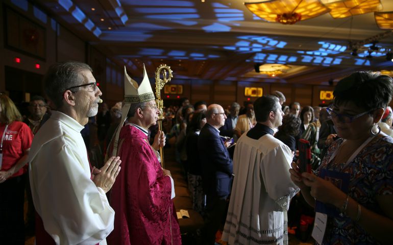 Baltimore Archbishop William E. Lori processes during the Fortnight for Freedom Mass July 3 at the "Convocation of Catholic Leaders: The Joy of the Gospel in America." (CNS photo/Bob Roller)