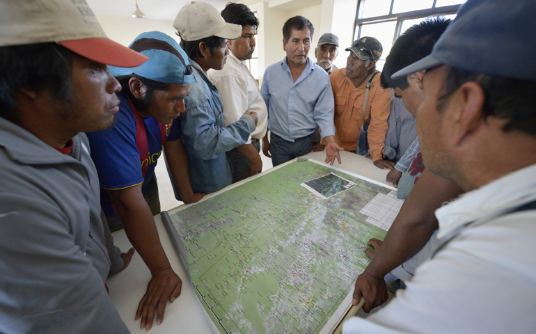 Wichi indigenous leaders in the Chaco region in northern Argentina discuss the division of land between their people and non-indigenous families living in the area during a break in a negotiating session in late August in Santa Victoria Este. (CNS/Paul Jeffrey) 