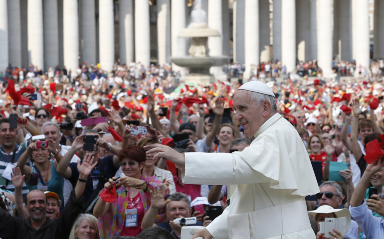 Pope Francis arrives to greet participants in the Renewal of the Spirit meeting Friday in St. Peter's Square at the Vatican. (CNS/Paul Haring)