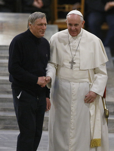 Pope Francis shakes hands with Fr. Luigi Ciotti, founder of the Italian anti-Mafia group Libera, at the Church of St. Gregory VII in Rome in March. (CNS/Paul Haring)