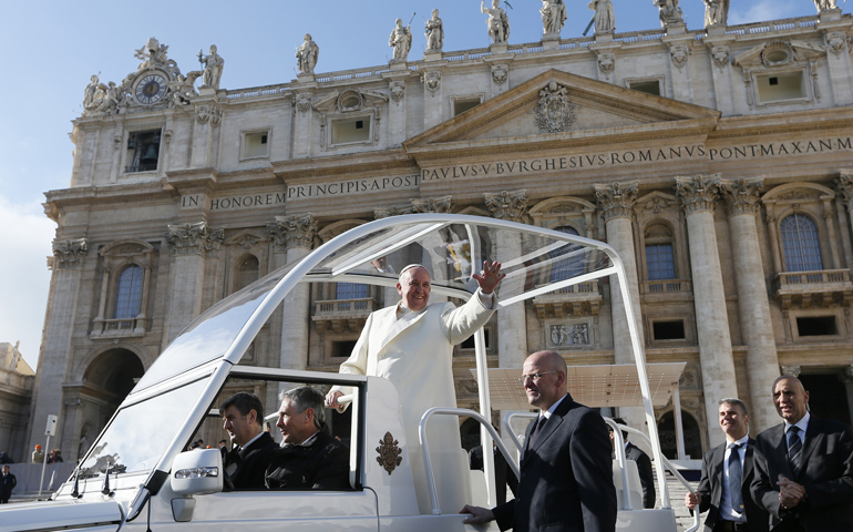 Pope Francis greets the crowd Jan. 15 as he leaves his general audience in St. Peter's Square at the Vatican. (CNS/Paul Haring) 