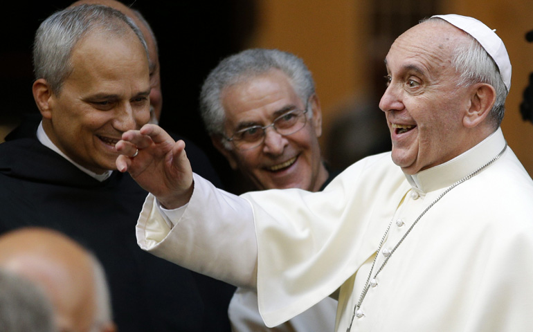 Pope Francis waves to well-wishers as he arrives to celebrate Mass at the Basilica of St. Augustine in Rome on the saint's feast day Wednesday. (CNS/Reuters/Max Rossi)