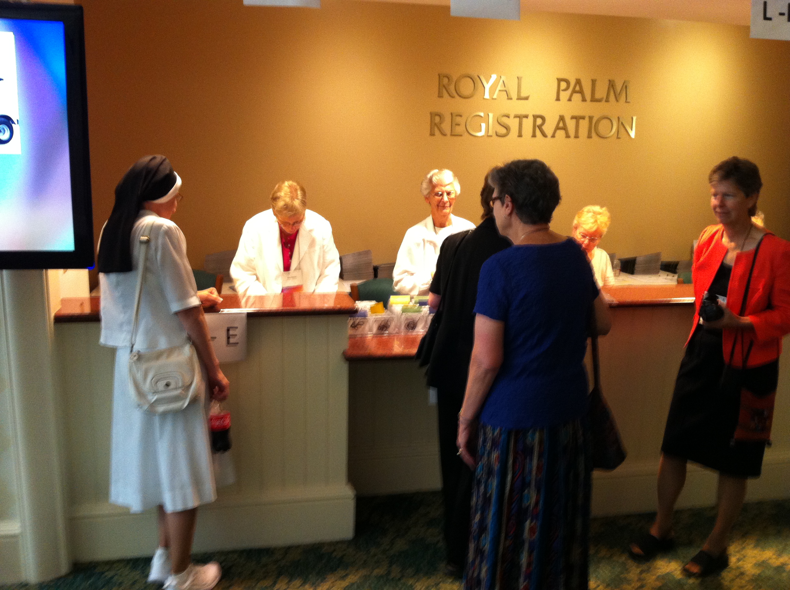 Women religious checking in to the assembly (NCR photos/ Thomas C. Fox)